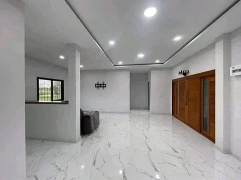 A spacious interior with white marble-look flooring